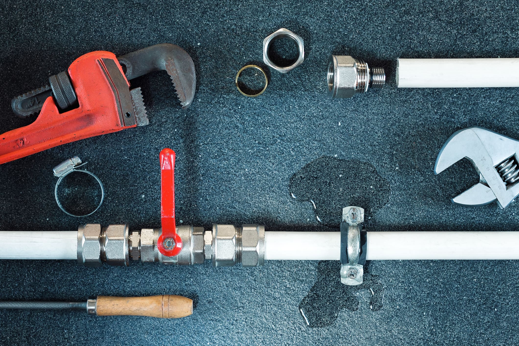 Plumbing Tools and Leaky Pipe